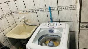 a small bathroom with a toilet and a sink at GUARÁS - Complete & excellent locationCOP 30 in Belém +61 photos
