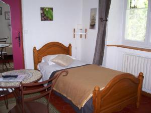 Postel nebo postele na pokoji v ubytování Auberge Cocagne