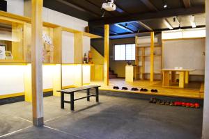 a room with a table and a bunch of bottles at Ryokan Matsumuraya in Kawagoe