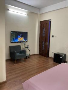 TV a/nebo společenská místnost v ubytování Ribi Home + 12 fotografií