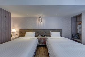Katil atau katil-katil dalam bilik di Lan Kwai Fong Garden Hotel
