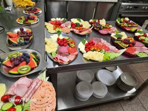 a bunch of plates of food on a table at Bike Hostel&Camp in Przewóz