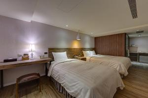 Katil atau katil-katil dalam bilik di Lan Kwai Fong Garden Hotel