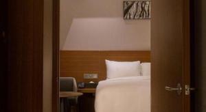 Top Cloud Hotel Iksan客房内的一张或多张床位