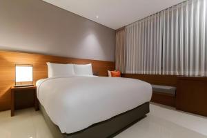 Top Cloud Hotel Iksan客房内的一张或多张床位