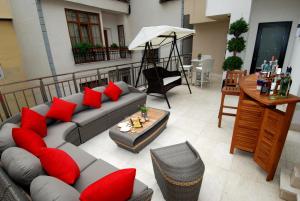 a living room with a couch and red pillows at Dosso Dossi Hotels Old City in Istanbul