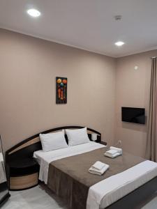 Postel nebo postele na pokoji v ubytování Astoria Hotel