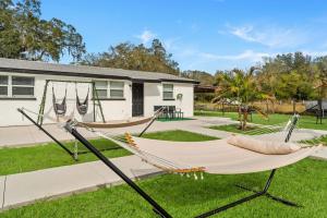 two hammocks in a yard in front of a house at The Peaceful Village Unit#3 in Plant City