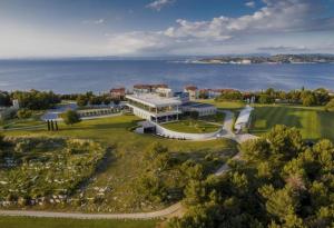 an aerial view of a large building on a golf course at Villa Luxor in Zambratija