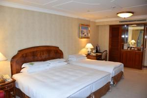 Voodi või voodid majutusasutuse Evergreen Laurel Hotel Taipei toas