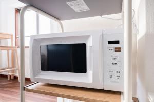 TV a/nebo společenská místnost v ubytování ガイア歌舞伎町壱番館204