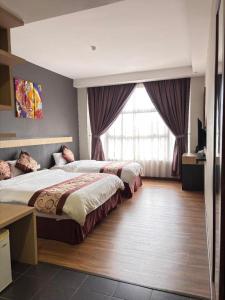 Ένα ή περισσότερα κρεβάτια σε δωμάτιο στο Lot 10 Boutique Hotel