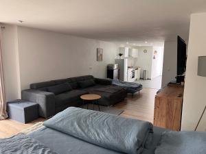 a living room with a couch and a table at FeWo Landzeit in Bad Arolsen