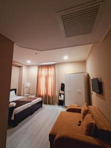 Postel nebo postele na pokoji v ubytování Astoria Hotel