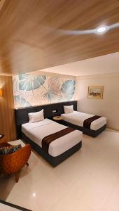 Кровать или кровати в номере HOTEL ASRI CIREBON