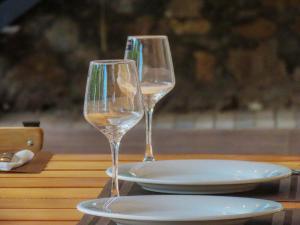 two wine glasses sitting on top of a table at Yala Zafiro in Kataragama