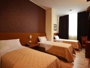 Postel nebo postele na pokoji v ubytování Hotel Austria