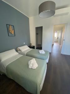Postel nebo postele na pokoji v ubytování 57 Design - Settimo Milanese, 2 camere da letto e 2 bagni