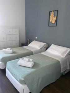 Postel nebo postele na pokoji v ubytování 57 Design - Settimo Milanese, 2 camere da letto e 2 bagni