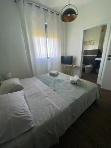 Postel nebo postele na pokoji v ubytování 57 Design - Settimo Milanese, 2 camere da letto e 2 bagni