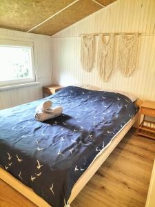 Postel nebo postele na pokoji v ubytování Domek Letniskowy