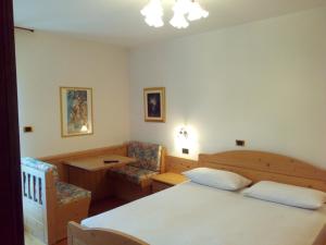 Postel nebo postele na pokoji v ubytování B&B Casa Bazzanella