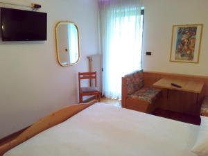 Postel nebo postele na pokoji v ubytování B&B Casa Bazzanella