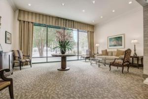 a living room with a couch and a table at Stayatl Premier 2 Bed Condo W Views! in Atlanta