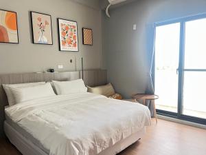 Cama o camas de una habitación en Manman Homestay