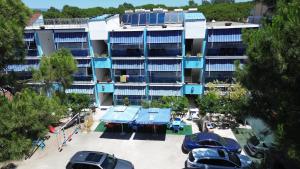 an apartment building with cars parked in front of it at Residenza Seliano in Velipojë