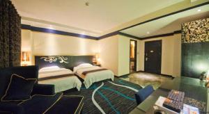 Un ou plusieurs lits dans un hébergement de l'établissement Guilin Sapphire hotel