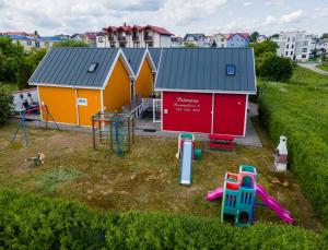 an aerial view of a playground in front of a building at Domki Primore in Władysławowo