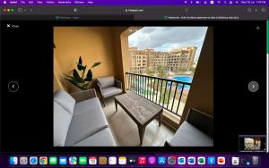 a picture of a balcony with a view of a building at Hotel apartments Ninety Avenue New Cairo in Cairo
