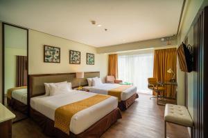 Łóżko lub łóżka w pokoju w obiekcie The Isabelle Hotel
