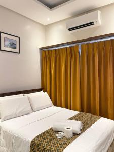 Katil atau katil-katil dalam bilik di Whitesandbar Inn