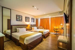 Łóżko lub łóżka w pokoju w obiekcie The Isabelle Hotel