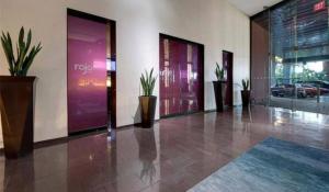 a lobby with potted plants on the walls of a building at Luxe Condo Free Parking No Resort Fees in Las Vegas +62 photos