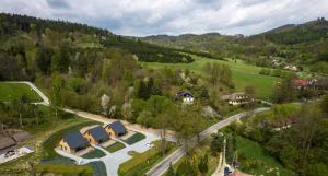 an aerial view of a resort in a valley at Domki Wilcza C in Wilcza