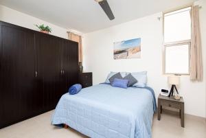 Una cama o camas en una habitación de Vista Del Arco