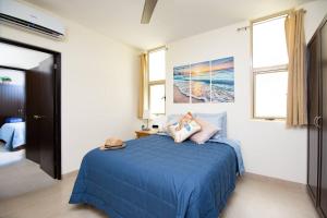 Una cama o camas en una habitación de Vista Del Arco
