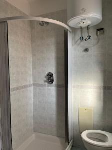 a bathroom with a shower and a toilet at Flat 23 Vico Equense centro in Vico Equense