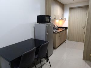 Kuchyň nebo kuchyňský kout v ubytování Condo unit on SMDC shore