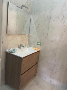 a bathroom with a sink and a mirror at Gemma Rooms in Santa Maria La Carità