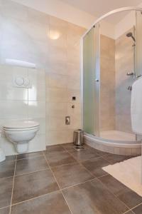 a bathroom with a toilet and a shower at Apartment Bonaca in Posedarje +74 photos
