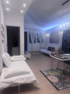 a living room with two beds and a couch at Maria House in Artemida