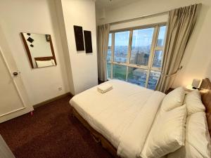 Katil atau katil-katil dalam bilik di 2 Bedrooms - Central of Kuching City +56 gambar