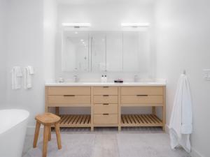 a bathroom with a sink and a mirror at RMR: Tram Tower 5 Condo in Teton Village in Teton Village