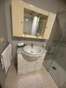 a bathroom with a sink and a shower at Casa Parlera in Ribeira +44 photos