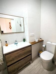 a bathroom with a sink and a toilet and a mirror at Casa Fina in Anna +34 photos