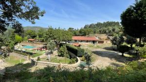an estate with a swimming pool and a house at Quinta dos Amores in Ponte de Lima